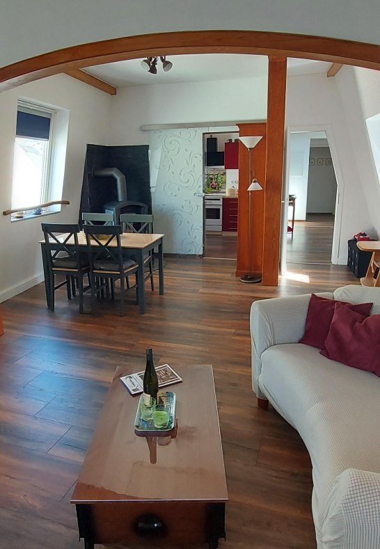 Liebenstein living and dining room with wood stove | &copy; Heimes